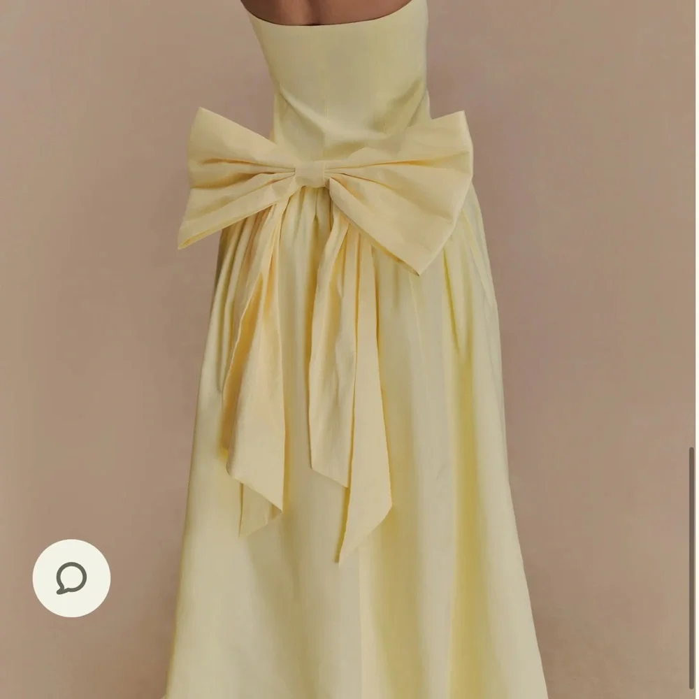 Elegant Butter Yellow Strapless Dress with Bow - Picture 2 of 4